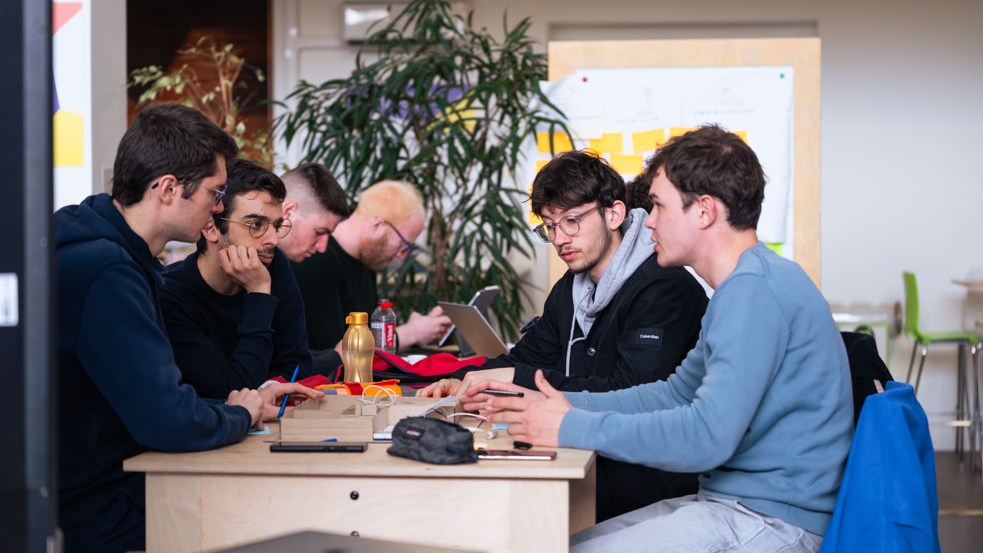 Innovation hackathon with diverse teams collaborating on AI solutions