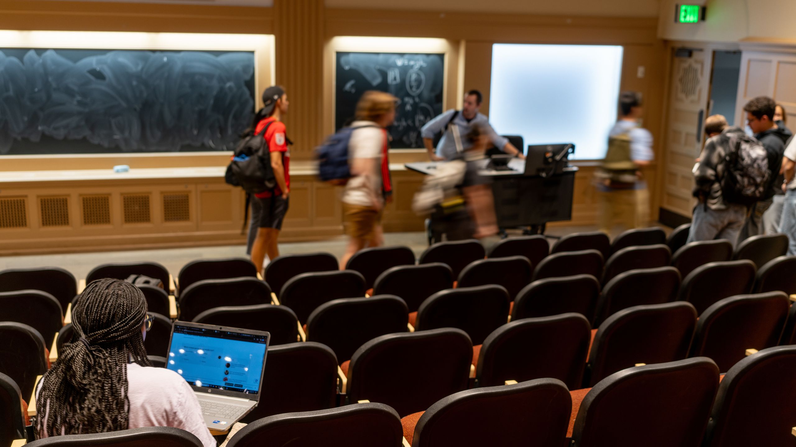 University lecture hall with modern AI technology setup and engaged students